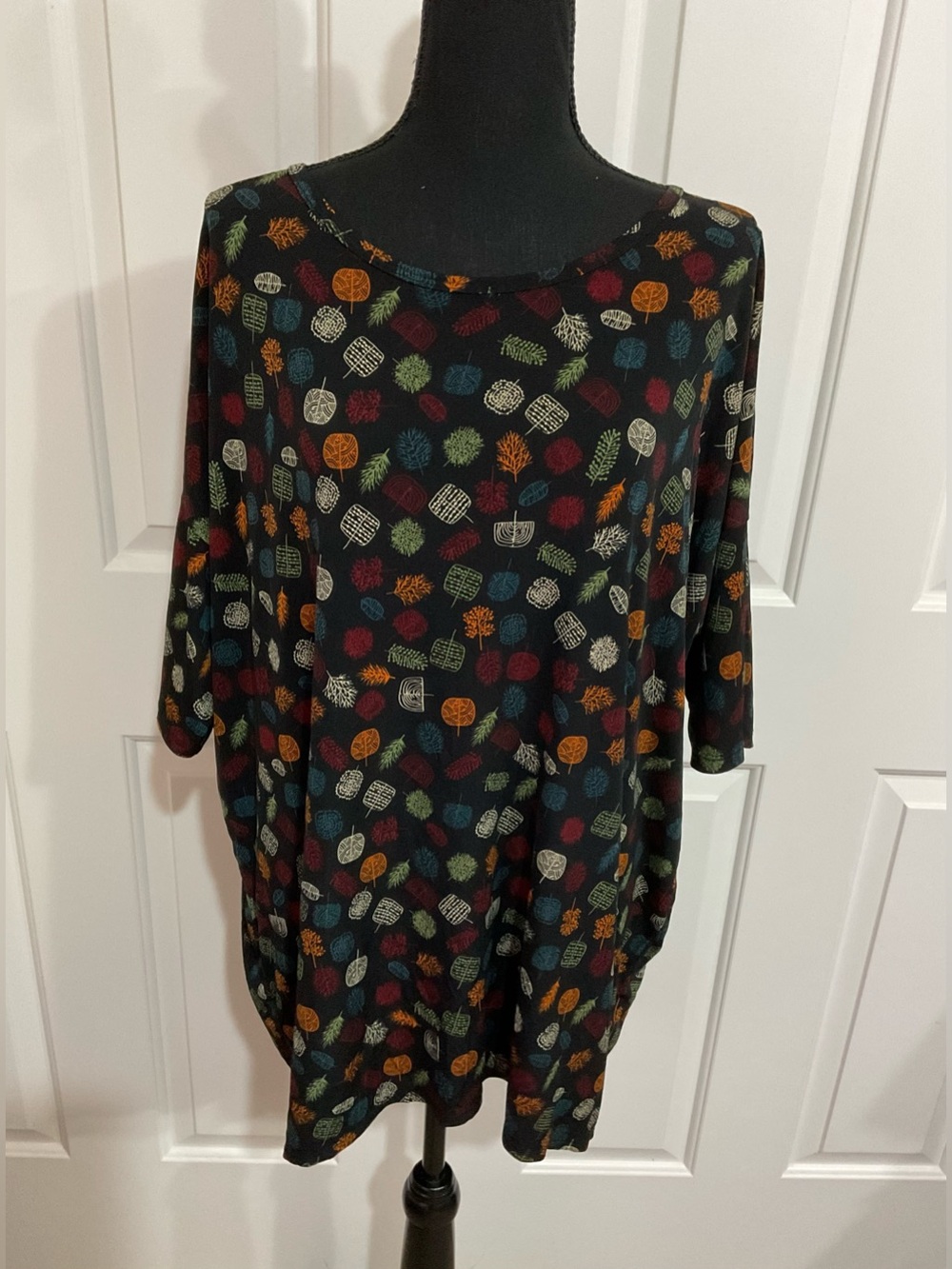LuLaRoe Black Irma Tunic with Multicolor Leaf Motif